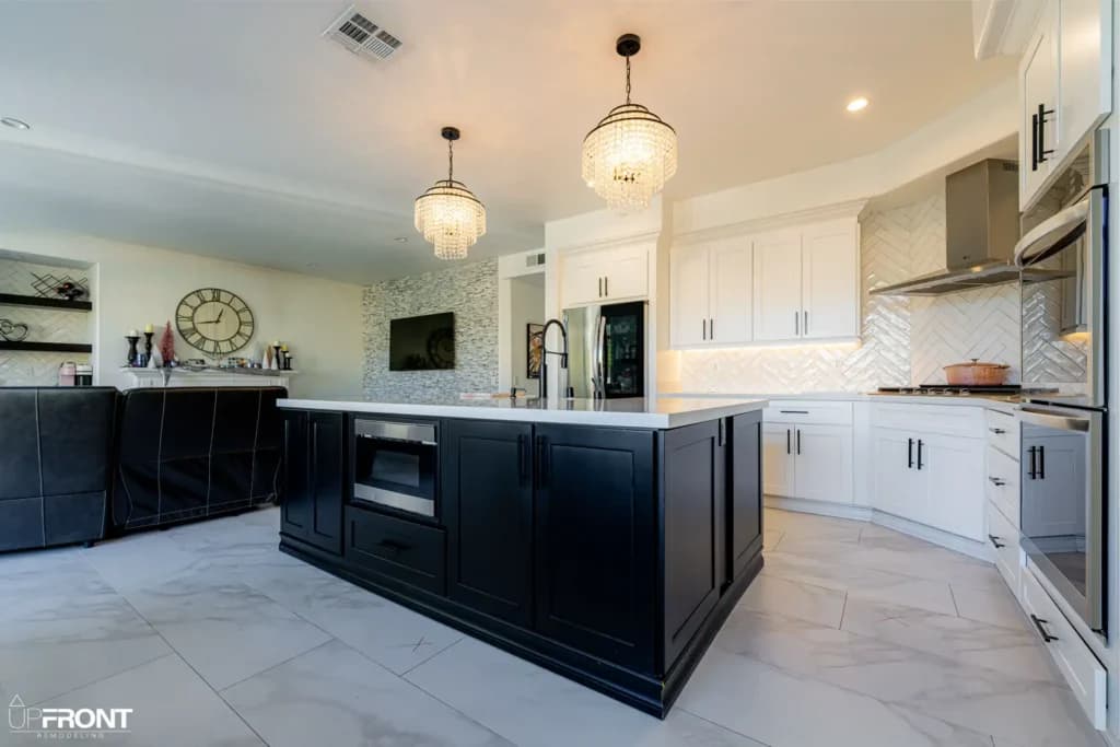 Black-and-white kitchen and bathroom remodel in Moorpark, with white shaker cabinetry and a black island — photo 5 of 18