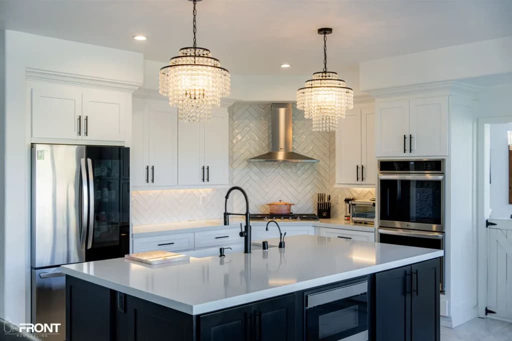 Black-and-white kitchen and bathroom remodel in Moorpark, with white shaker cabinetry and a black island — photo 12 of 18