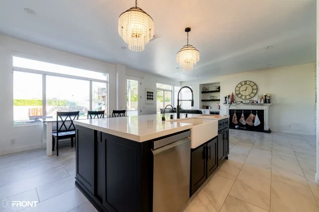 Black-and-white kitchen and bathroom remodel in Moorpark, with white shaker cabinetry and a black island — photo 17 of 18