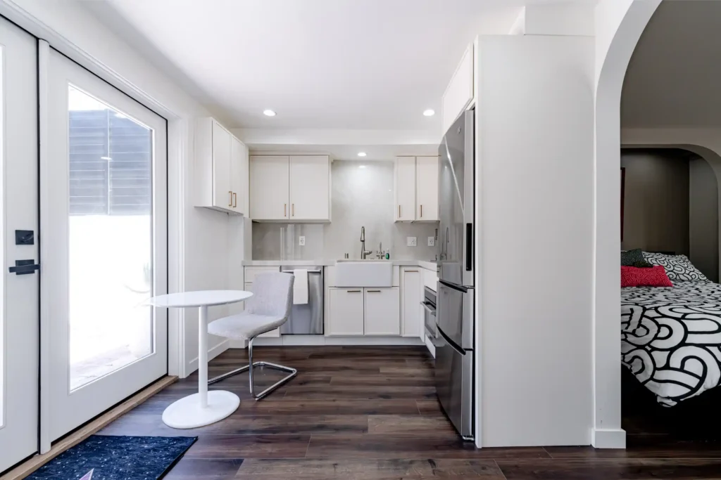 Kitchen and Junior ADU remodel in Hollywood, with natural oak cabinetry and a quartz waterfall island — photo 1 of 20