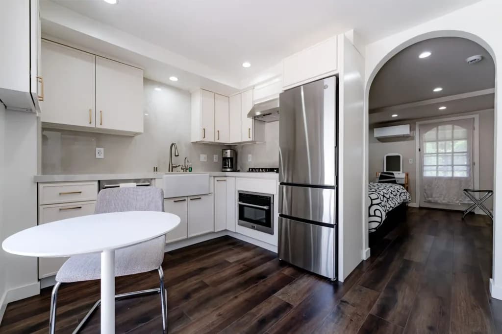 Kitchen and Junior ADU remodel in Hollywood, with natural oak cabinetry and a quartz waterfall island — photo 2 of 20