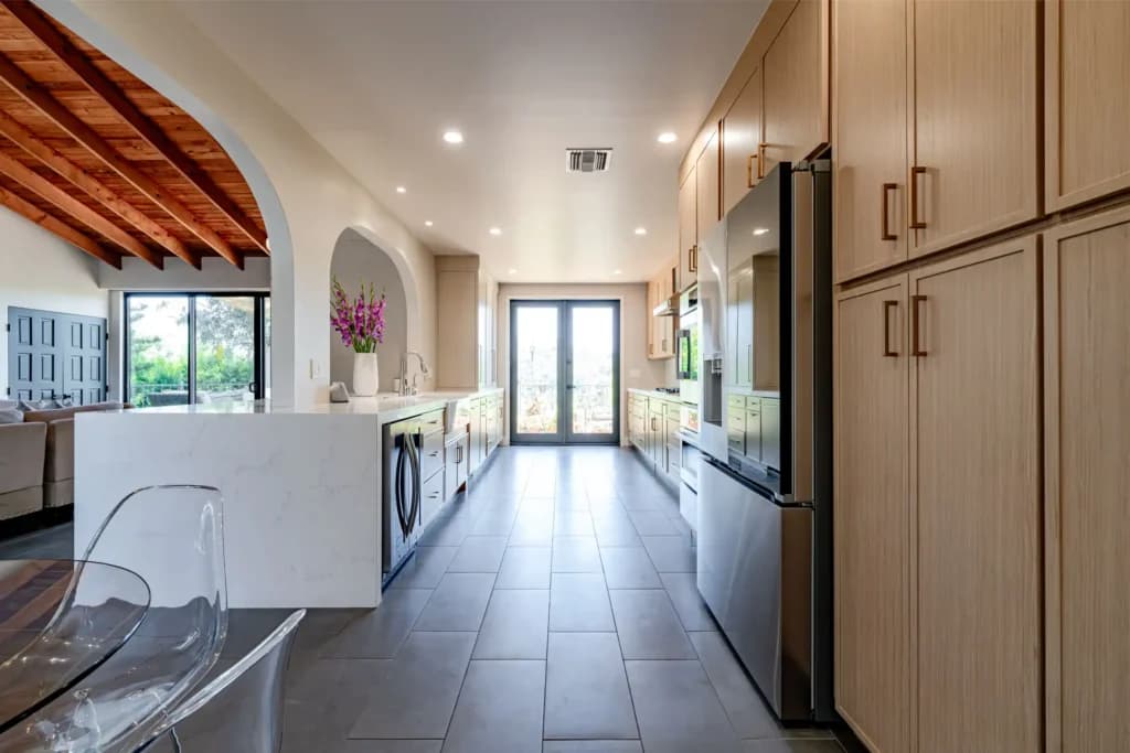 Kitchen and Junior ADU remodel in Hollywood, with natural oak cabinetry and a quartz waterfall island — photo 13 of 20