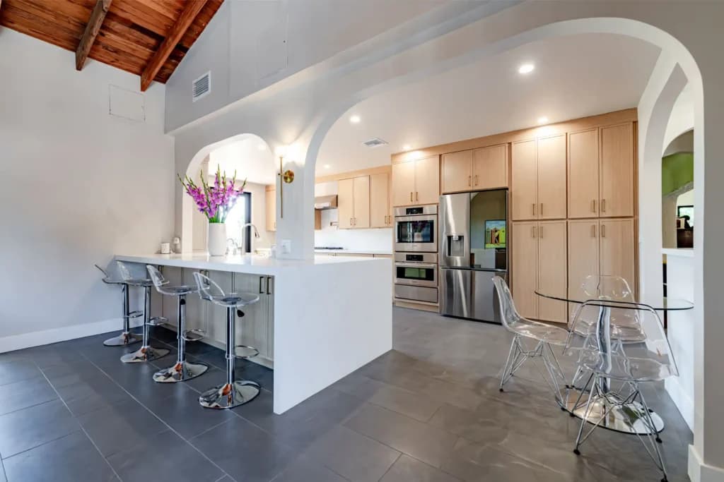 Kitchen and Junior ADU remodel in Hollywood, with natural oak cabinetry and a quartz waterfall island — photo 14 of 20