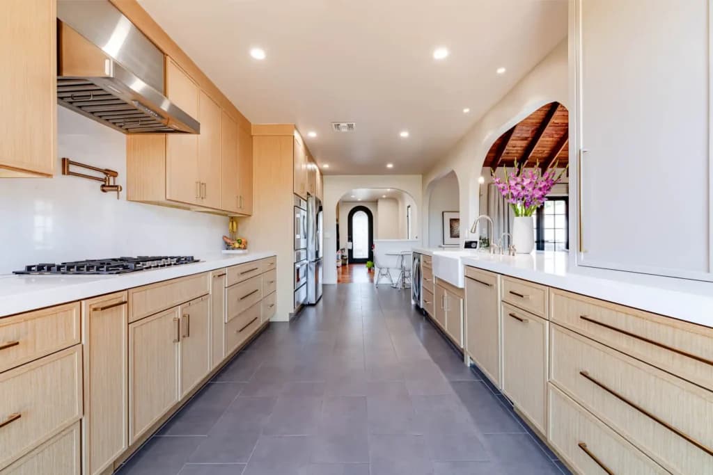 Kitchen and Junior ADU remodel in Hollywood, with natural oak cabinetry and a quartz waterfall island — photo 17 of 20