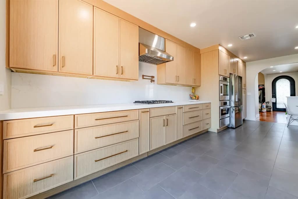 Kitchen and Junior ADU remodel in Hollywood, with natural oak cabinetry and a quartz waterfall island — photo 18 of 20
