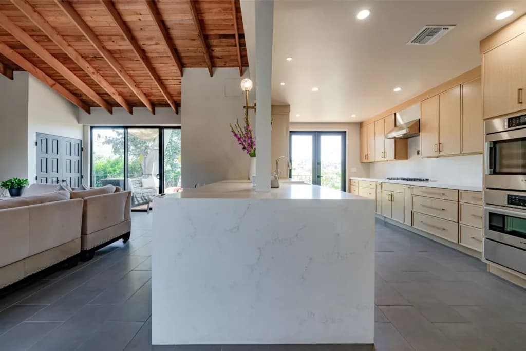 Kitchen and Junior ADU remodel in Hollywood, with natural oak cabinetry and a quartz waterfall island — photo 19 of 20