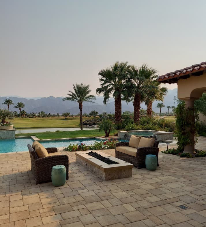 Custom backyard remodel with patio, fire pit, and pergola by UpFront Remodeling