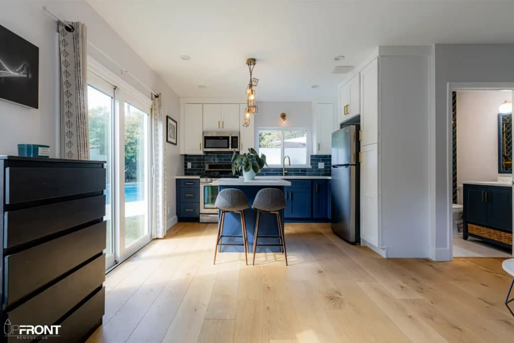 Garage converted into a self-contained ADU in Valley Village, with navy shaker cabinetry and quartz counters — photo 5 of 13