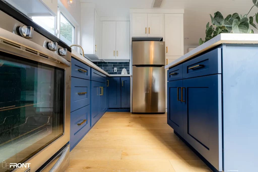 Garage converted into a self-contained ADU in Valley Village, with navy shaker cabinetry and quartz counters — photo 12 of 13