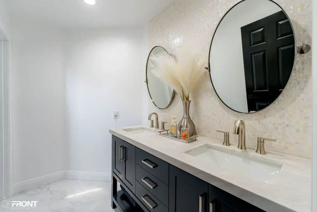 Master and kids' bathroom remodel in Moorpark, with Calacatta marble-look porcelain and a matte black vanity — photo 7 of 8