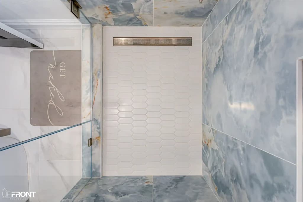 Master and kids' bathroom remodel in Moorpark, with Calacatta marble-look porcelain and a matte black vanity — photo 8 of 8