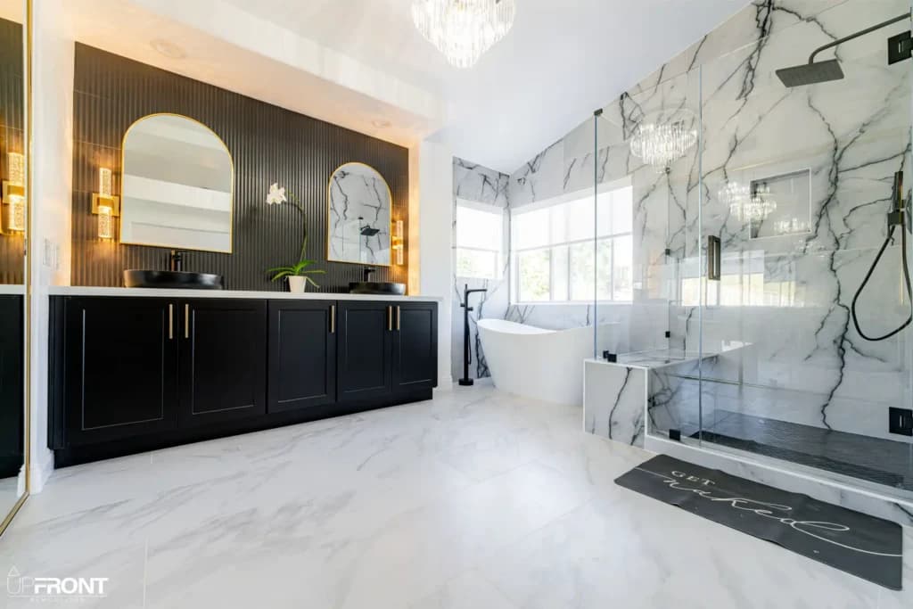 Master and kids' bathroom remodel in Moorpark, with Calacatta marble-look porcelain and a matte black vanity — photo 2 of 8