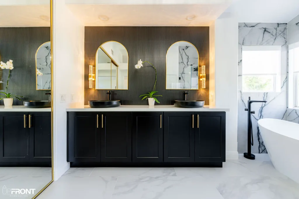 Master and kids' bathroom remodel in Moorpark, with Calacatta marble-look porcelain and a matte black vanity — photo 3 of 8