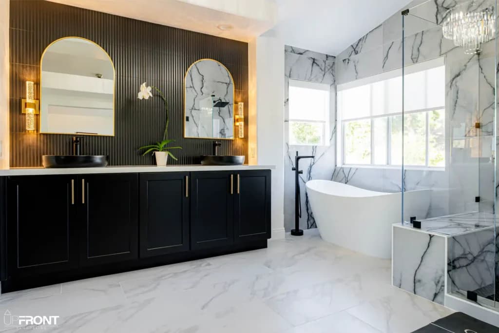 Master and kids' bathroom remodel in Moorpark, with Calacatta marble-look porcelain and a matte black vanity — photo 4 of 8