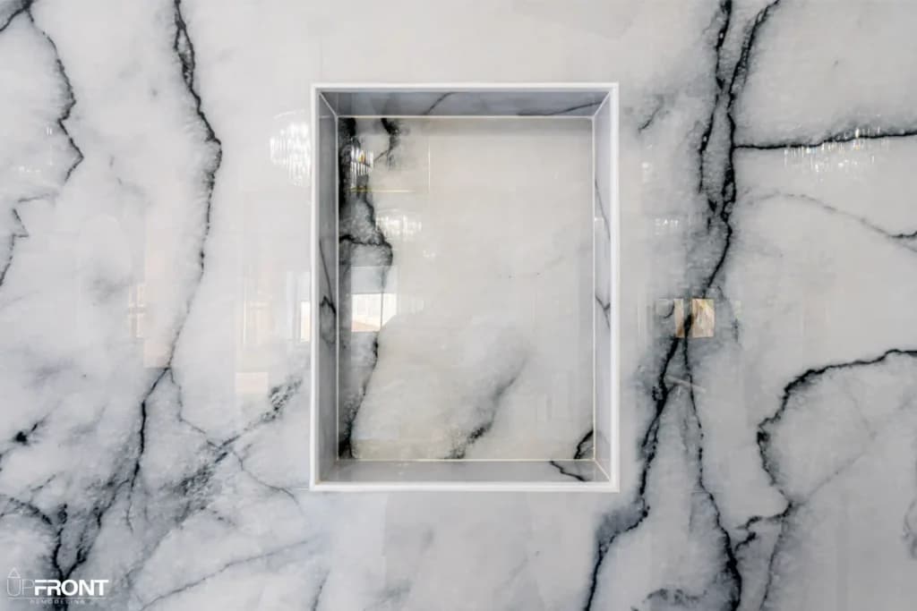 Master and kids' bathroom remodel in Moorpark, with Calacatta marble-look porcelain and a matte black vanity — photo 5 of 8