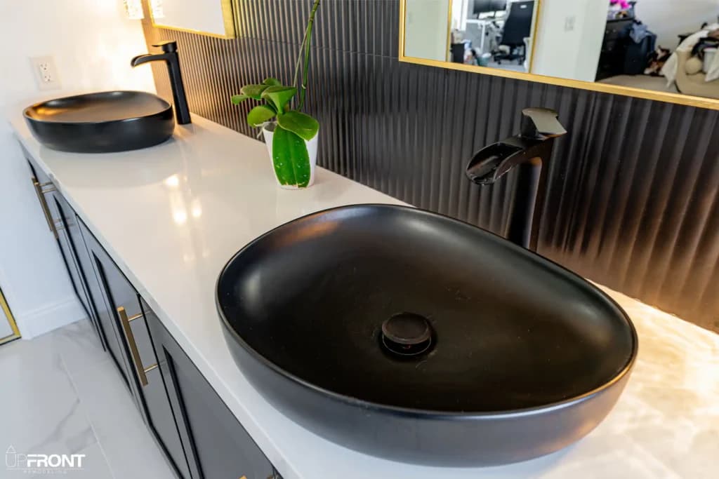Master and kids' bathroom remodel in Moorpark, with Calacatta marble-look porcelain and a matte black vanity — photo 6 of 8