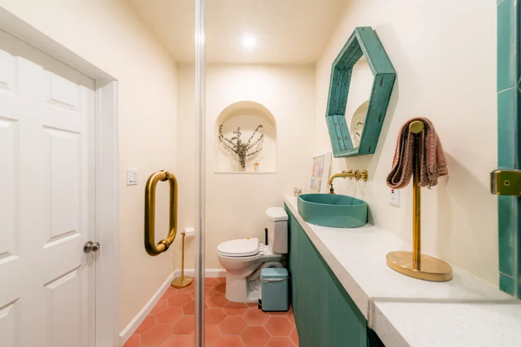 Master and guest bathroom remodel in Los Angeles, with a tiled walk-in shower and dual-sink quartz vanity — photo 9 of 13