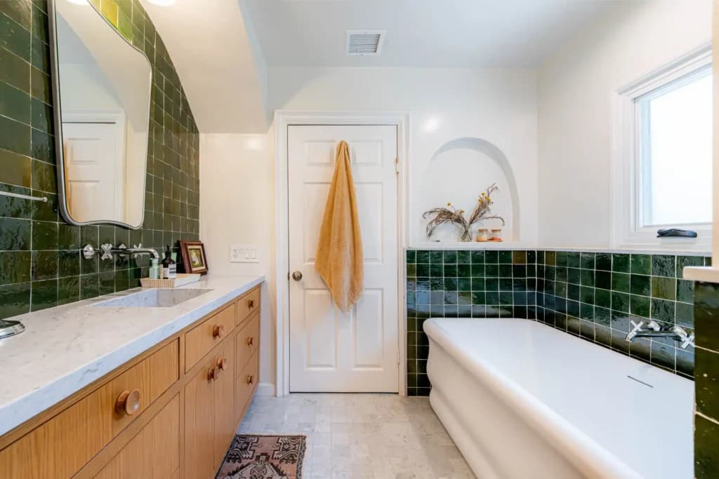 Master and guest bathroom remodel in Los Angeles, with a tiled walk-in shower and dual-sink quartz vanity — photo 7 of 13