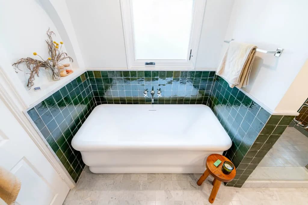 Master and guest bathroom remodel in Los Angeles, with a tiled walk-in shower and dual-sink quartz vanity — photo 2 of 13