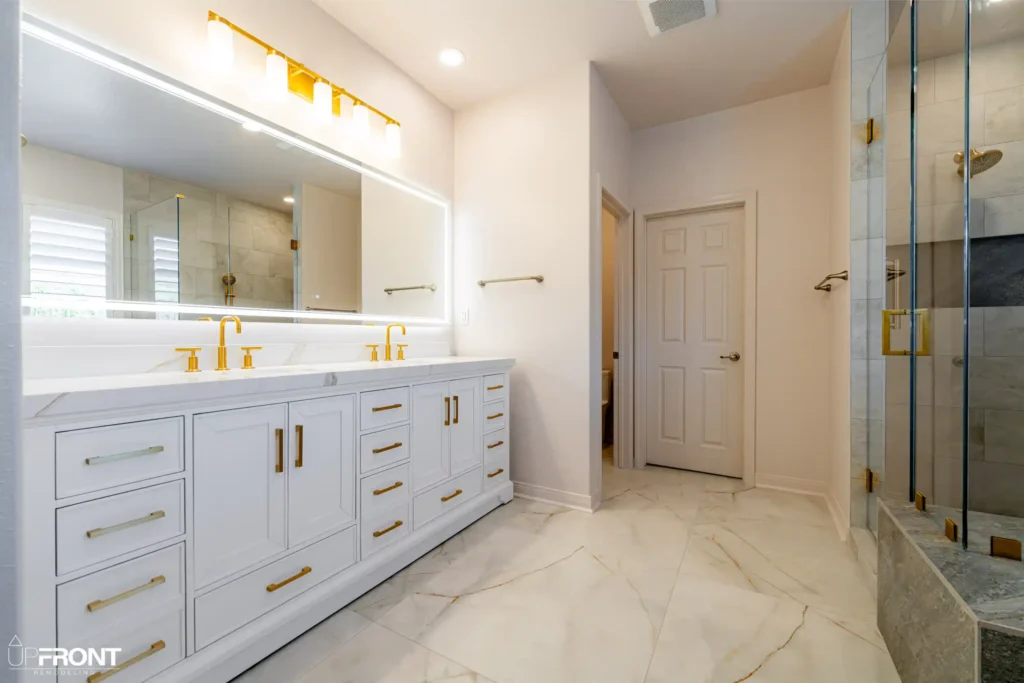 Spa-inspired master bathroom remodel in Simi Valley, with a brushed-gold double vanity and walk-in shower — photo 2 of 9